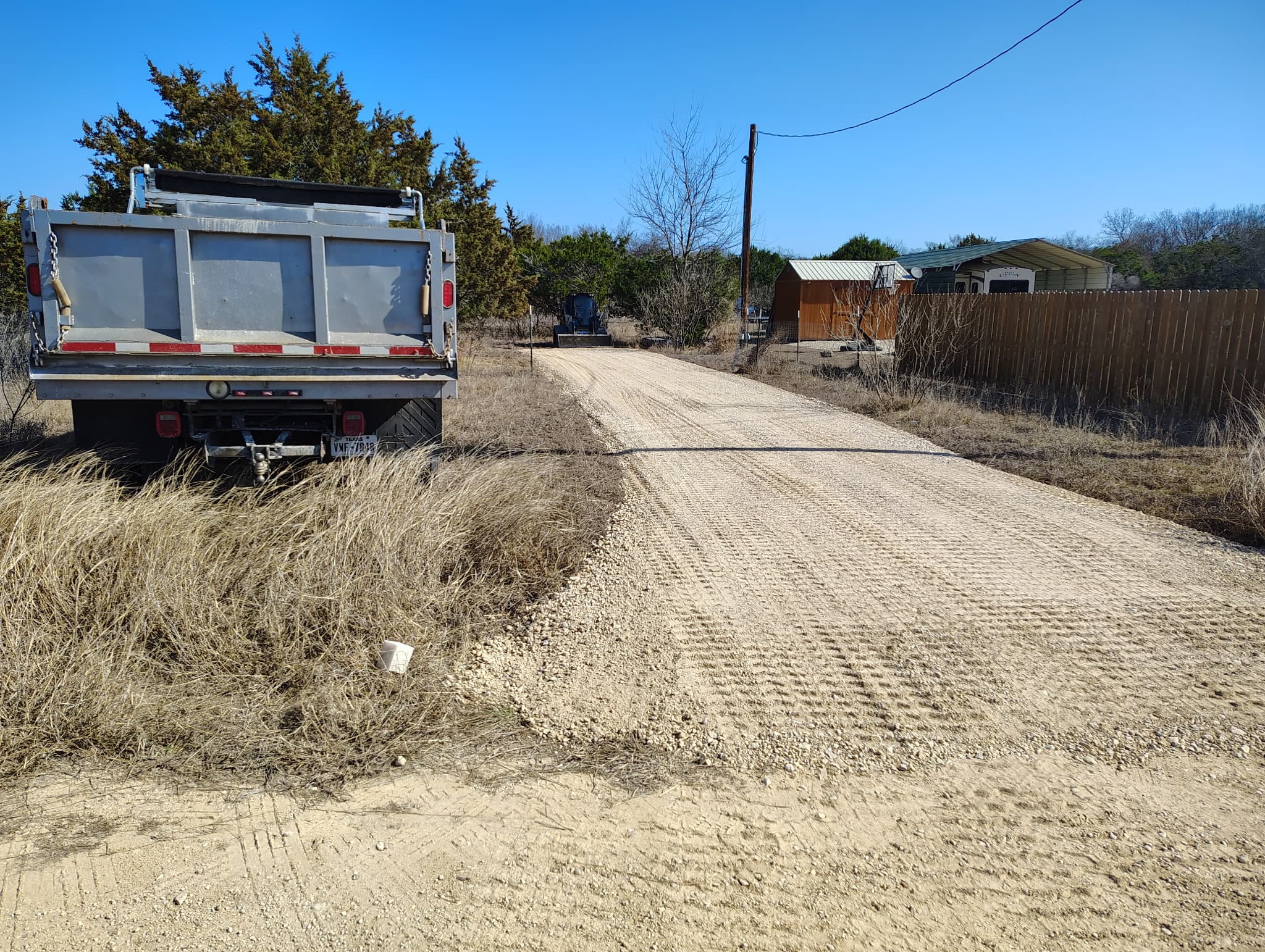 Caliche road grading on a Hill Country ranch